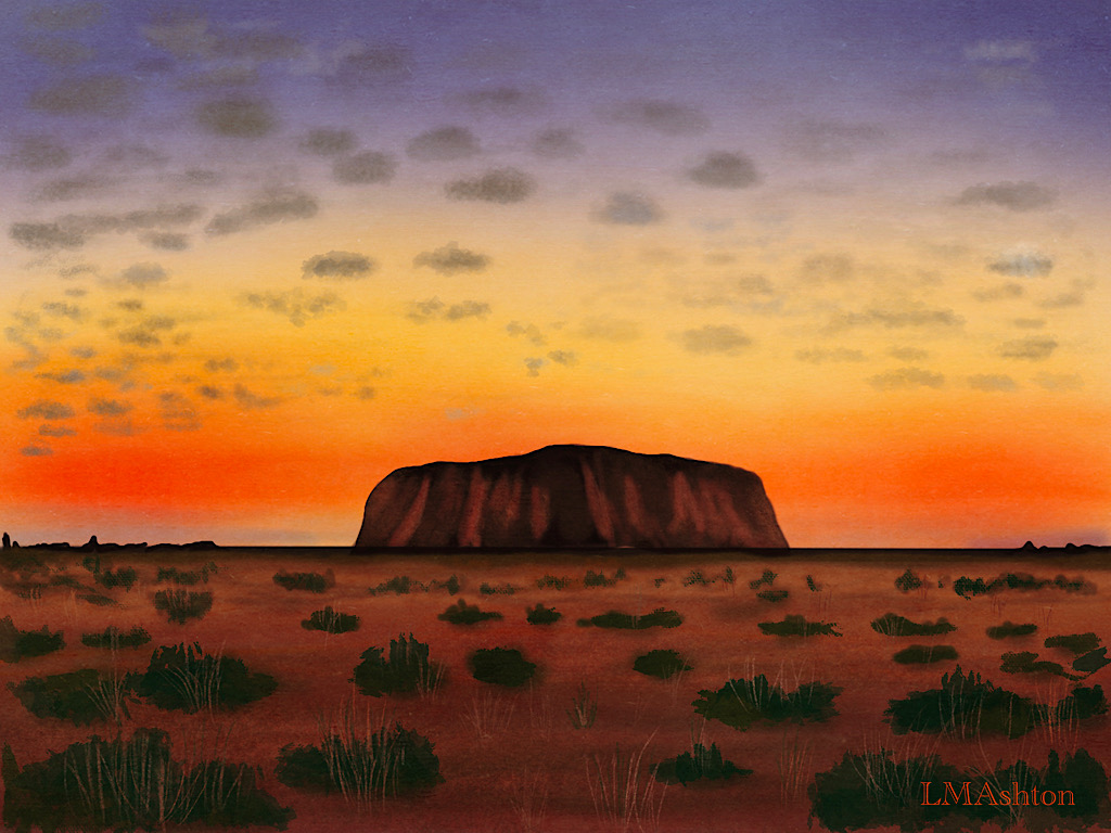 A sun setting behind Uluru rock. The sky is a riot of red, yellow, and blue.